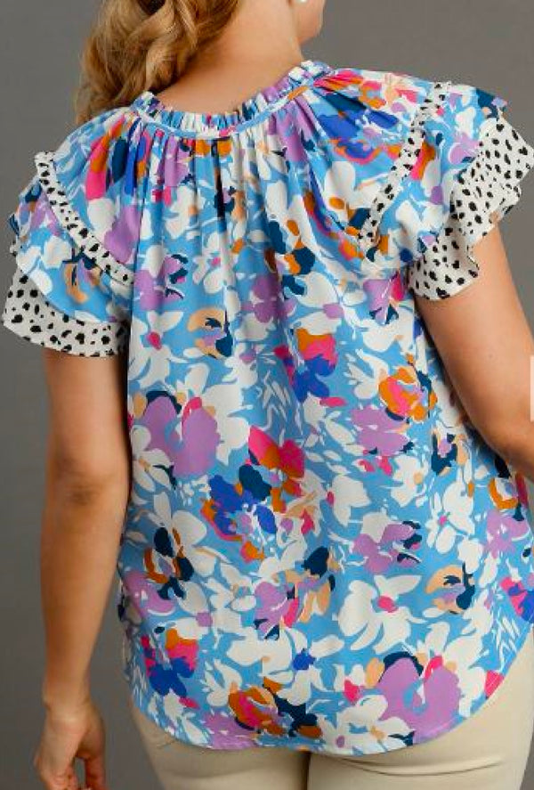 Ayanna - Umgee Mixed floral and dalmation print blouse with double layered flutter sleeves and neck tie details - Lt Blue Mix